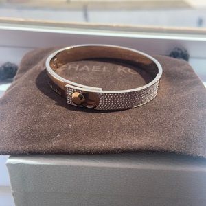 - Micheal Kors bangle new never used color bronze